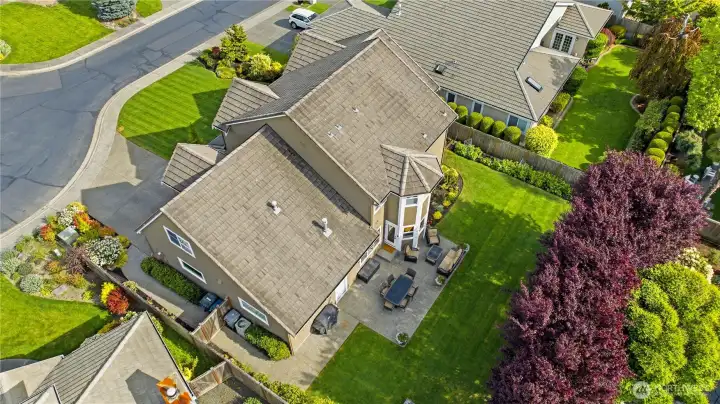 An aerial view showcasing manicured lawns and meticulous landscaping.