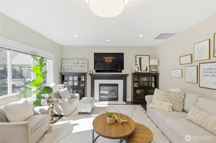 A cozy gas fireplace anchors the space.