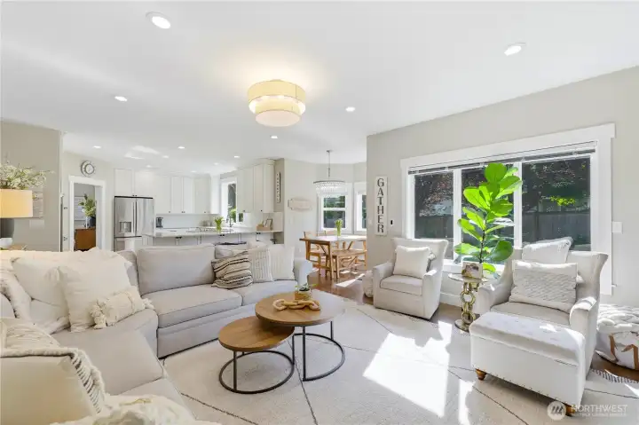 Large west-facing picture windows bring in natural light and serene outdoor views.