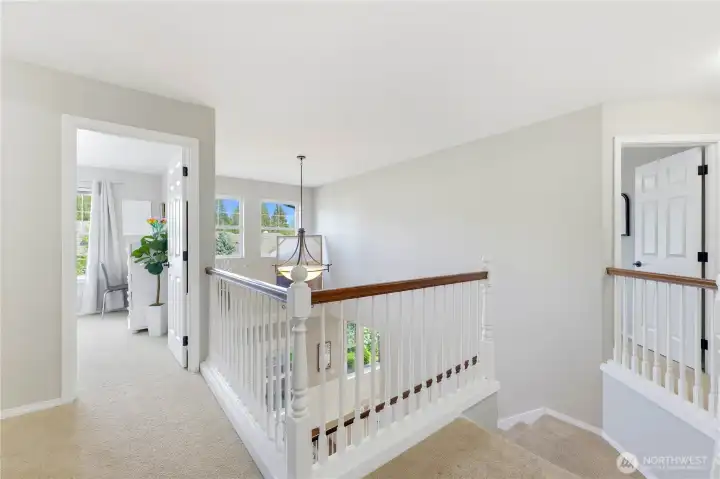 The upstairs landing is filled with natural light.