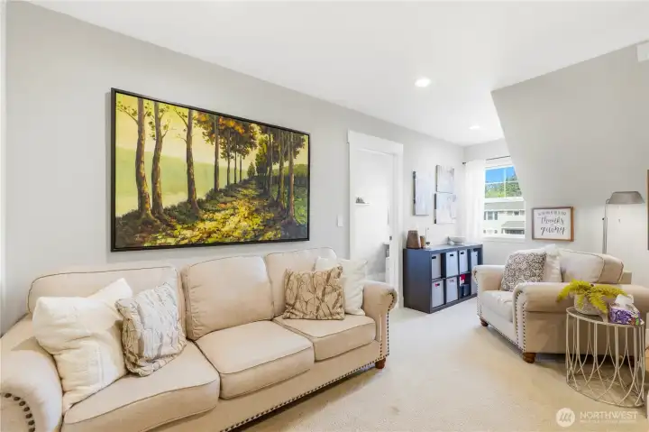 The bonus room was thoughtfully divided to create a fourth bedroom while maintaining flexible living space.