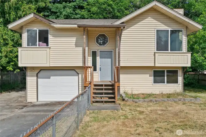 Charming home tucked away in a peaceful, tree lined neighborhood.