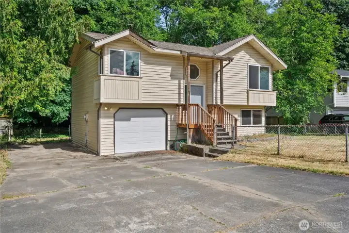 Attached garage with plenty of parking + RV parking.