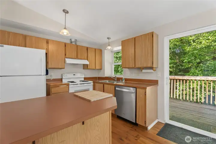 Convenient kitchen layout with sliding door access to the back deck.