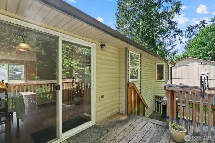 Step out onto the massive, multi level back deck, overlooking a private and tranquil backyard.