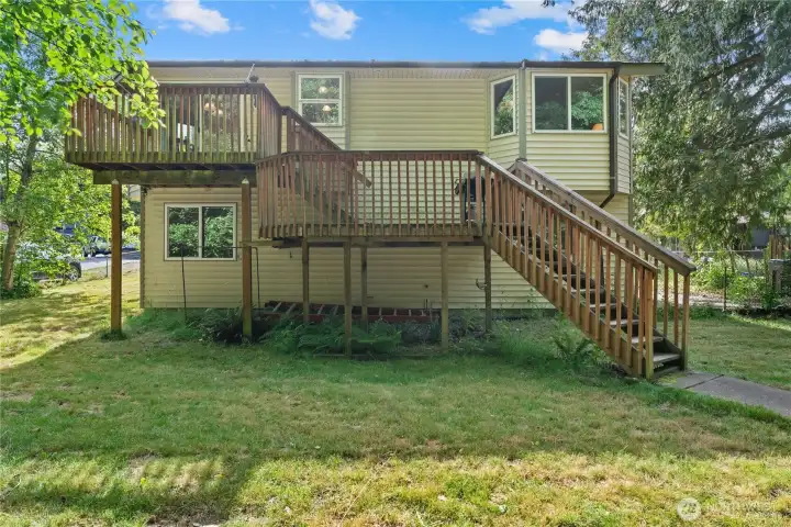 Rear view of the home showing the impressive scale of the deck.