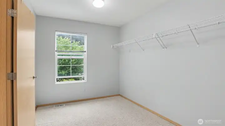 Large walk-in closet in the primary bathroom.