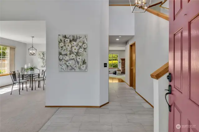 Chic ceramic tile and newer carpet in a nice neutral grey set the tone as you enter this bright and contemporary home.