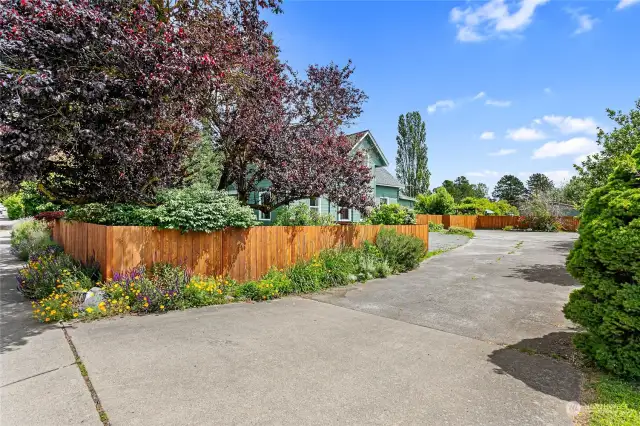 Large paved driveway, great landscaping, all fenced.