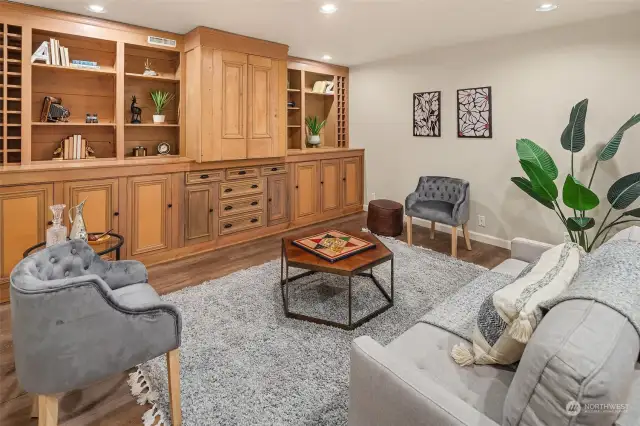 Media room with built-in antique cabinetry.