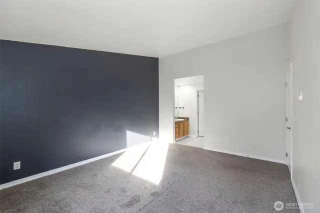 Primary Bedroom and View to Primary Bath