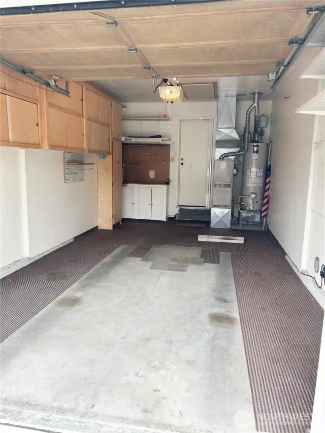 With these built-ins cabinets this Garage has /plenty of great storage