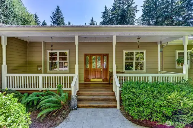 The front porch.  Imagine some comfy wicker furniture to sit on and enjoy a shaded spot or better yet, out of the rain...!