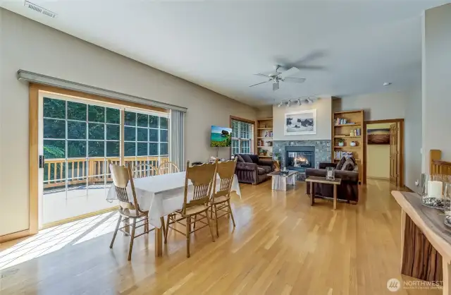 Lots of room to spread out, expand the table.  Or, maybe move the table for some at home dancing?  Easy access to a huge wrap around deck and access to the pool.