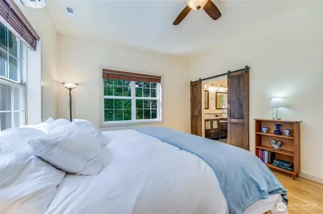 The primary suite with barn door action for the access to the bathroom.
