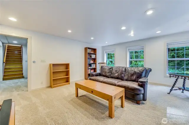Mil lounge space with three rooms that could be used for sleeping areas.