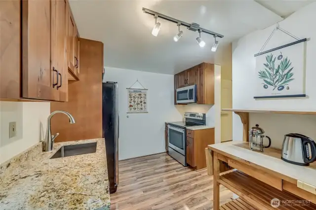 MIL kitchen area with enough room to make a decent meal.