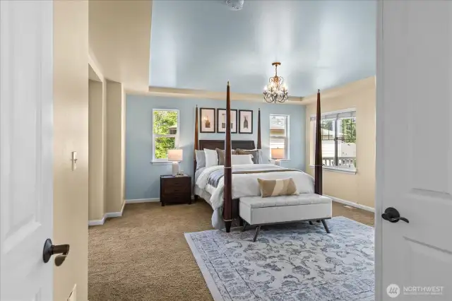 Welcome to your primary suite with double doors, coffered ceilings, private sitting area, private deck, walk-in-closet & 5-piece ensuite.