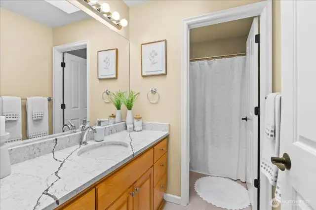 Upstairs main bath with private shower/toilet area.