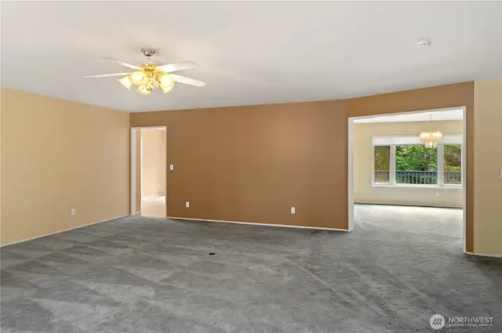 Living room facing dining on right and eating area off kitchen to the left.