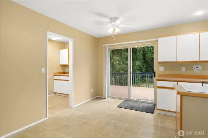 Eat in kitchen dining area with access to deck and mudroom off garage.