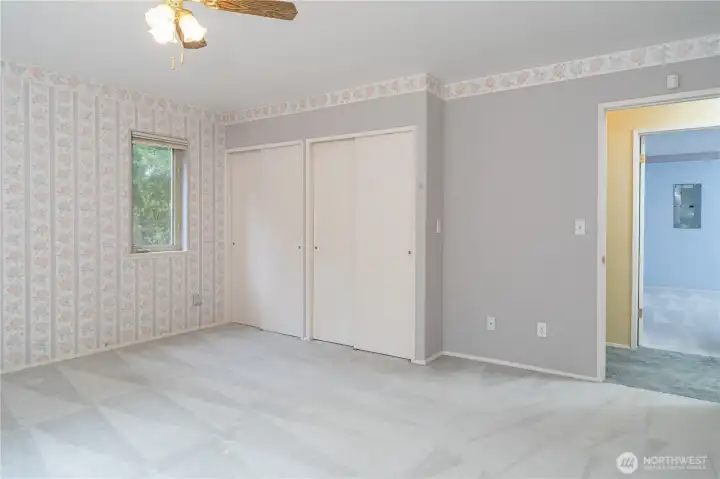 Primary Bedroom facing hallway showing 2 of 4 closet spaces in the room.