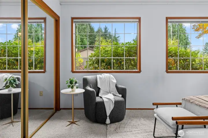 Several windows allow natural light to illuminate the space, creating a bright and welcoming atmosphere.