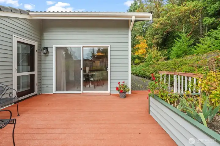 Accessible from the living and dining areas, the large deck offers a smooth transition between indoor and outdoor spaces.