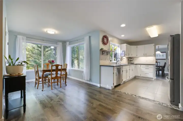 Breakfast nook area looking from second living space.Plenty of windows and natural light.