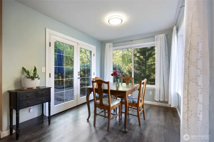 New french doors lead out to the adjacent private deck.