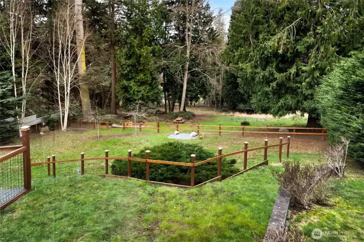 Gorgeous setting showcasing expansive grounds. Note: Large bush has been removed.