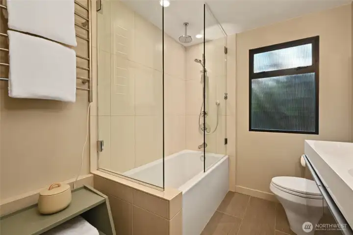 Newer bath with custom towel rack.