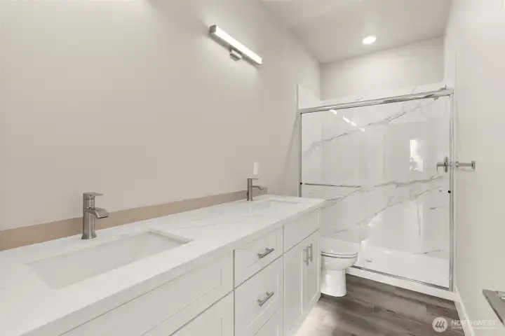 Images shown are from a different home previously constructed by this builder and are provided as examples of workmanship, finish quality, and design style only. The subject property is currently under construction, and specific materials, colors, fixtures, and features may differ upon completion.