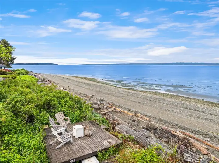While enjoying your own deeded beach access you can relax on the community platform with Adirondack chairs.
