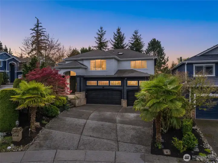 Stunning curb appeal with a beautifully landscaped front yard, expansive driveway, and 3 car garage. Attractive modern color scheme and well-appointed front entry.