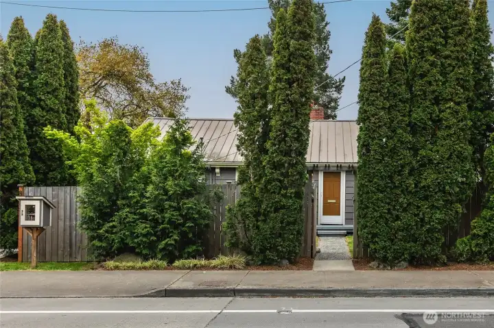 The front gate is hidden between the arborvitae...  for extra privacy