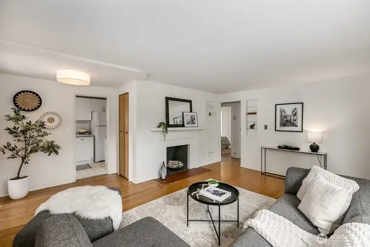 This angle shows the entrance to the kitchen plus another storage closet beside the fireplace.