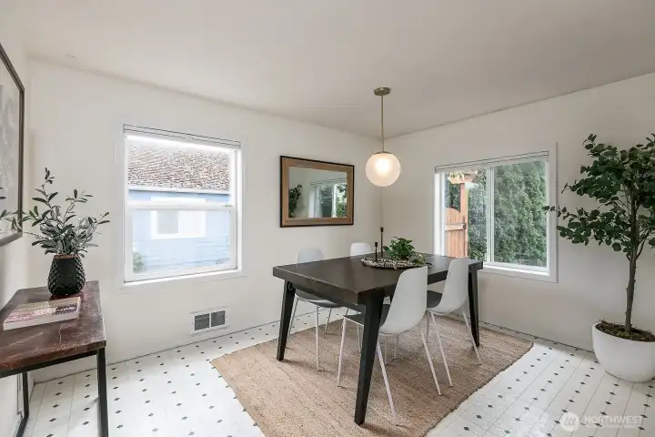 The dining area is large enough to fit a table for at least 6 if not more.  Notice the large windows for lots of natural light...