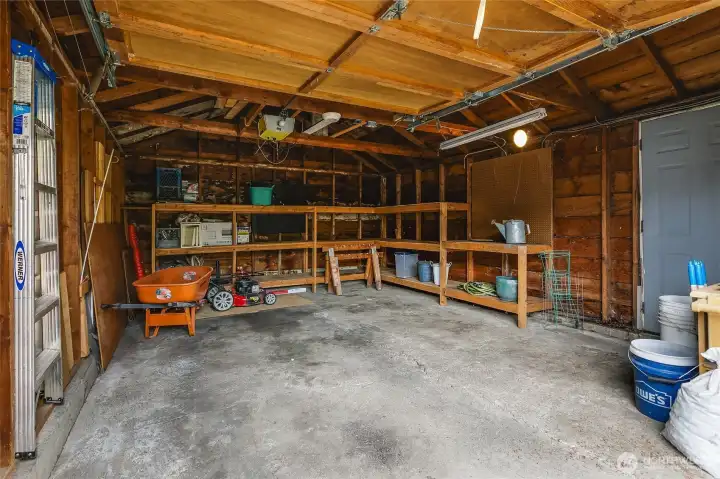 The garage is much larger than it looks.... with room for storage and/or shop or garden bench.