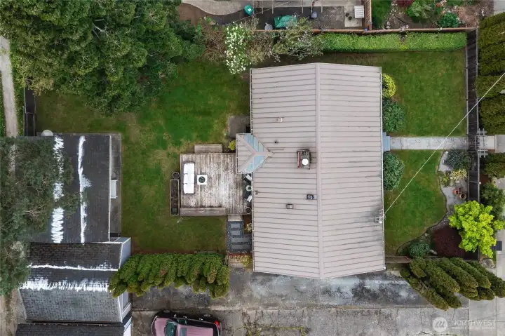 Gives a better perspective of the size of the lot.  The white on the roof of the garage and the covered patio was put on for moss control.