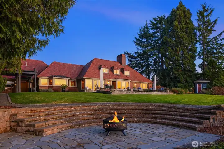 Outdoors, unwind by the cozy fire pit under the stars, soak in your private hot tub overlooking the water, or stroll down to your private stretch of beach.
