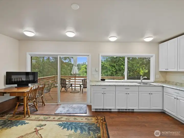 The wall of large windows and doors brings the outside in.