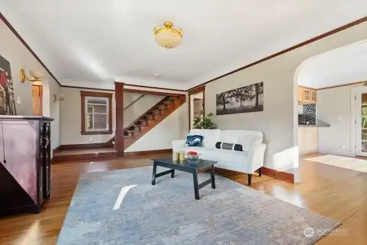 Living room leading to dining and upstairs