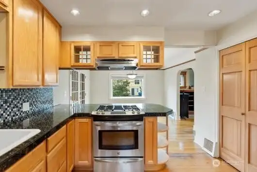 Kitchen facing dining room with South facing window
