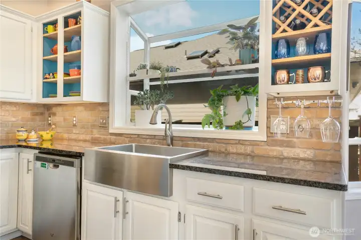 Farmhouse sink with a large green house window Farmhouse sink with a large green house window