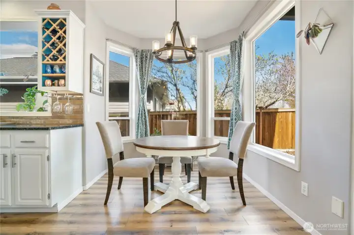 Right off the kitchen is a breakfast nook with large windows Right off the kitchen is a breakfast nook with large windows