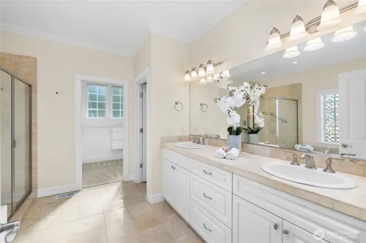 Primary bath is filled with natural light.