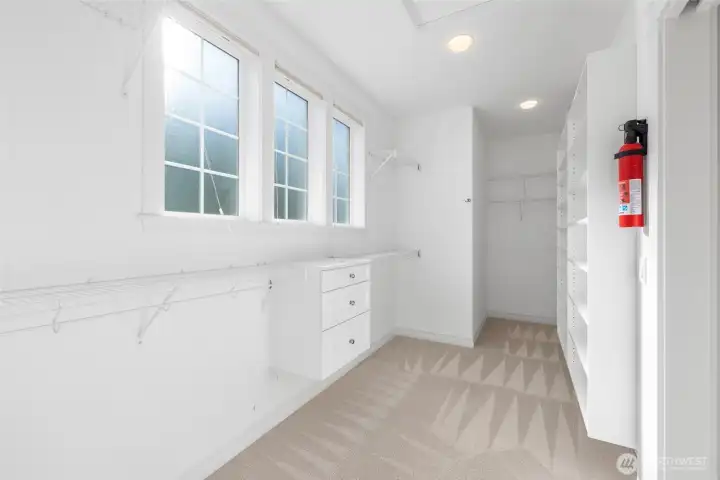 Primary closet features washer and dryer hookups to offer true main level living.