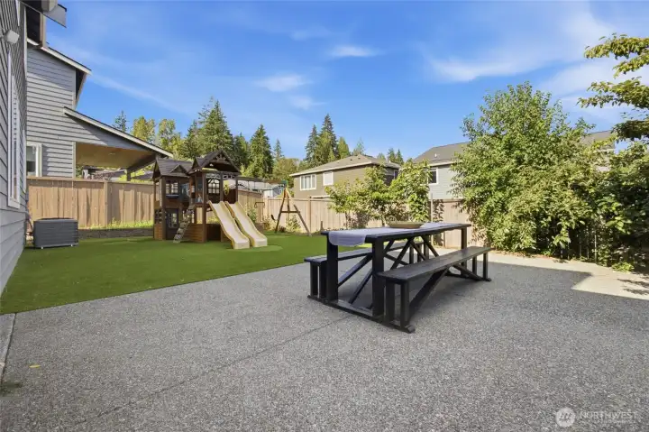 A backyard that's already finished and ready to enjoy with an expanded patio, low-maintenance turf, and room to play.