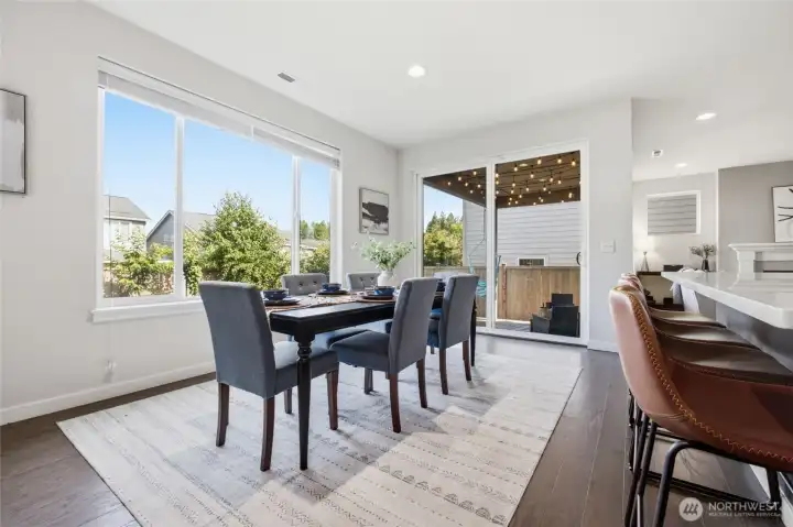 Dining flows seamlessly into the backyard, making indoor and outdoor entertaining easy.